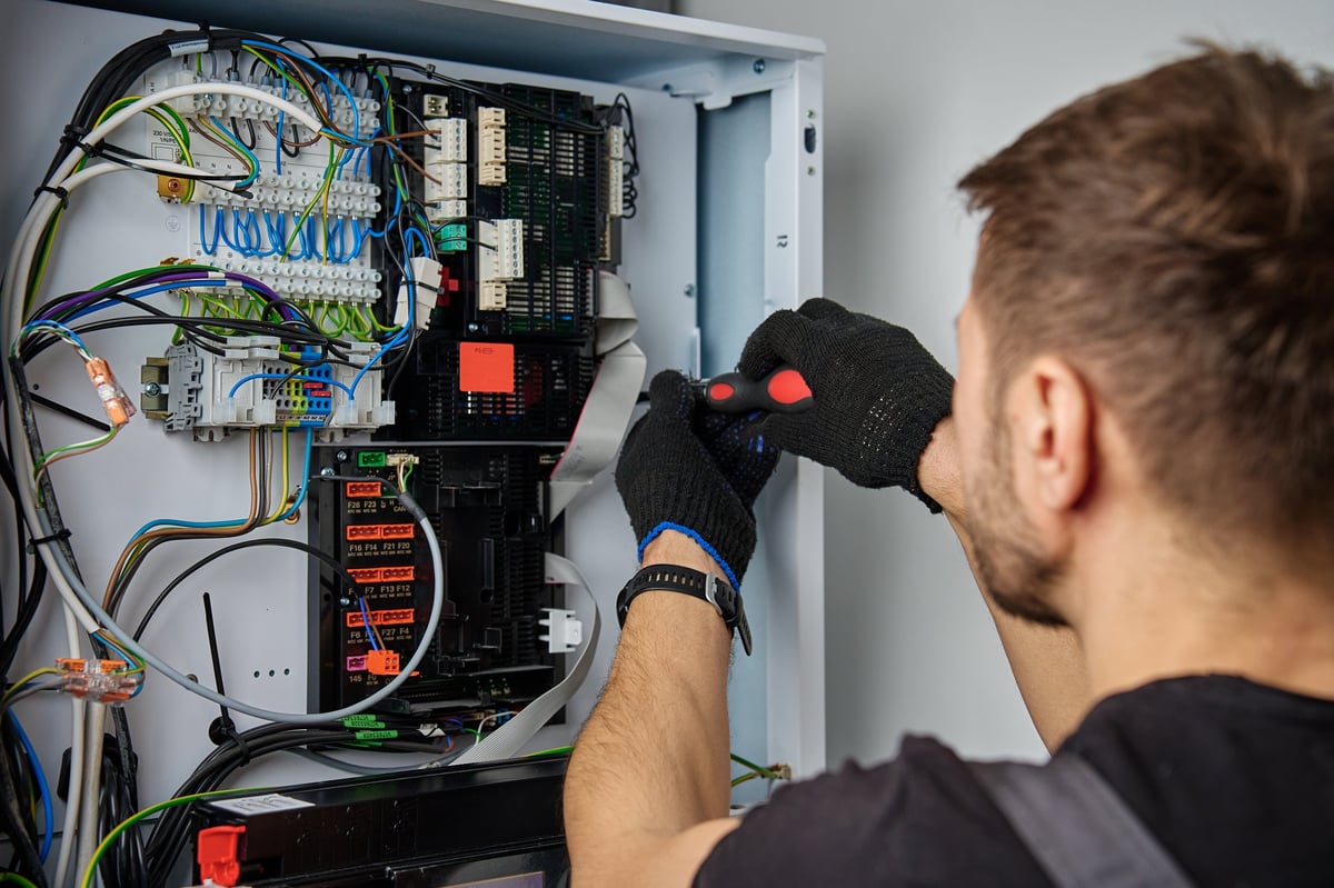 Reading electrician working on a residential property